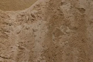 Concrete sand in Paver World’s original material or showroom photograph